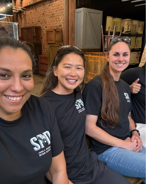 3 people smiling at camera